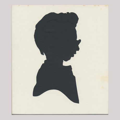 
        Front of silhouette, with boy looking right, wearing glasses.